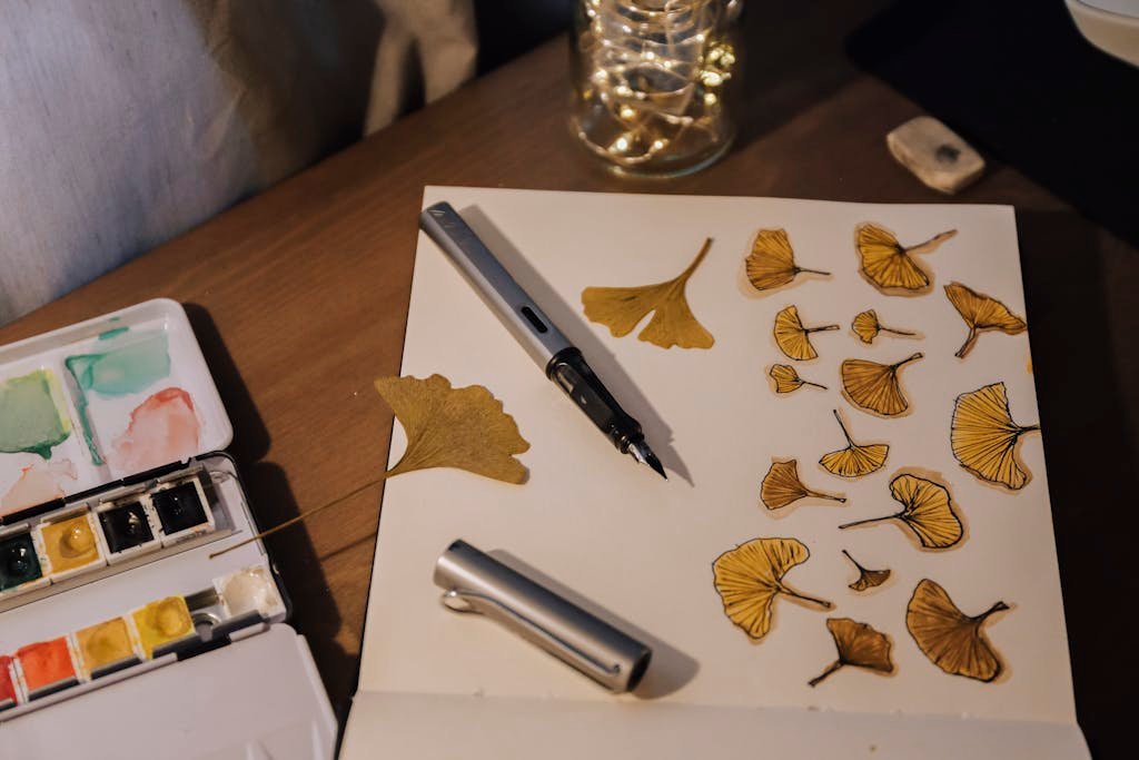 Watercolor Painting of Leaves on White Paper